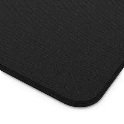 Close-up of a black mouse pad with a textured back surface.